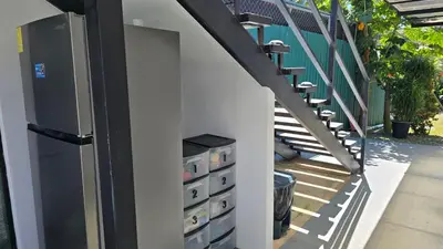 a building with a staircase with drawers on the side at Mango Coliving Rooms for Digital Nomads in Uvita