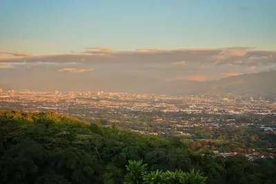 a view of a city from the top of a hill at Villas Aracari beautiful upscale homes with amazing views near SJO airport in Pilas