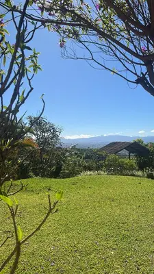 a field of green grass with a blue sky at Villas Aracari beautiful upscale homes with amazing views near SJO airport in Pilas