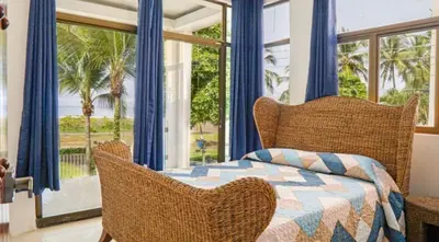 a bedroom with a bed and a large window at Millys house 12p max Jacó CR in Jacó