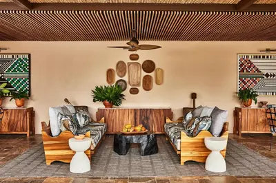 a living room with couches and a table at Hacienda AltaGracia, Auberge Collection in Santa Elena