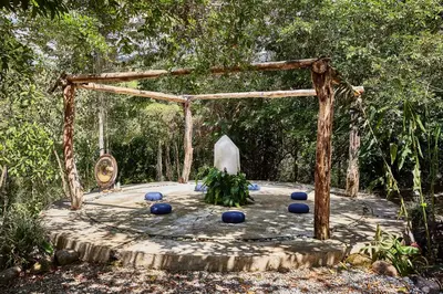 a wooden structure with blue spheres on a wooden table at Hacienda AltaGracia, Auberge Collection in Santa Elena