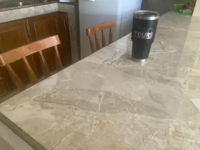 a marble table with a cup on top of it at Pinky s Place Alajuela City Airport Costa Rica in Alajuela City