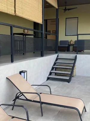 a couple of chairs sitting next to a ramp at Finca Quietud in Tarcoles