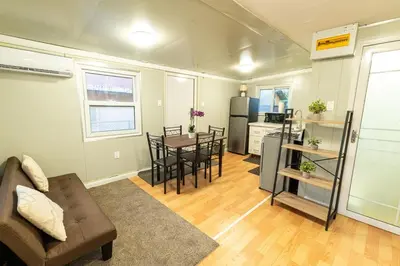 a living room with a couch and a table at Beautiful tiny house with AC WIFI in Santa Cruz