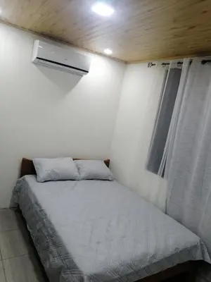 a small bedroom with a bed and a window at Apartamento JOKO in Villarreal