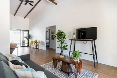a living room with a couch and a tv at Quinta Bella in Bagaces