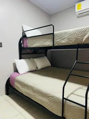 a room with two bunk beds in a room at Epic Arenal View House in Fortuna