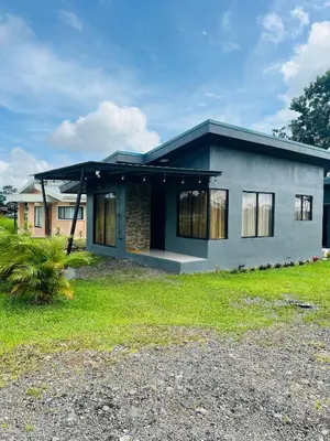 a small house with a roof at Epic Arenal View House in Fortuna