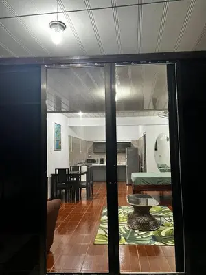 a view of a living room and dining room at Yireth Studio in Quepos