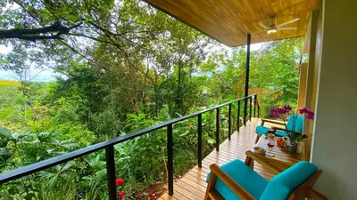 a balcony with a view of the forest at Casita Jungle Nest, 5 minutes drive to Playa Linda, 15 to Dominical, Wifi Starlink in Matapalo