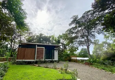 a small house in the middle of a yard at Casita Jungle Nest, 5 minutes drive to Playa Linda, 15 to Dominical, Wifi Starlink in Matapalo
