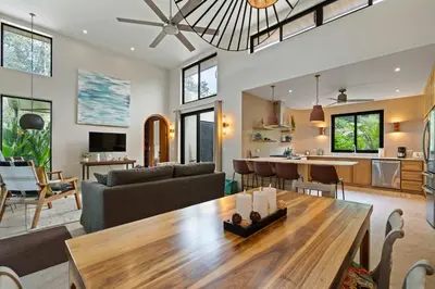 a living room with a couch and a table at 4 BD Tranquil Villa in Playa Grande
