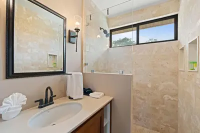 a bathroom with a sink and a shower at 4 BD Tranquil Villa in Playa Grande