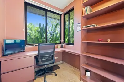 a home office with a desk and a chair and a window at 4 BD Tranquil Villa in Playa Grande