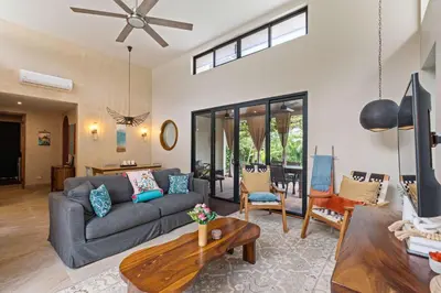 a living room with a couch and a table at 4 BD Tranquil Villa in Playa Grande