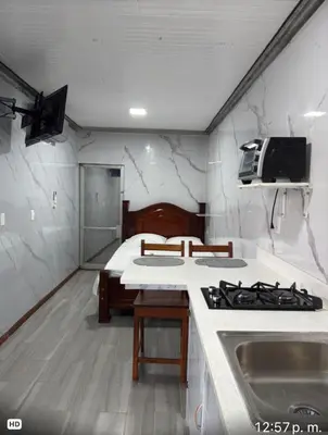 a kitchen with a stove and a counter top at Apartamento doña Lety in Fortuna