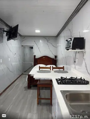 a kitchen with a stove and a counter top at Apartamento doña Lety in Fortuna