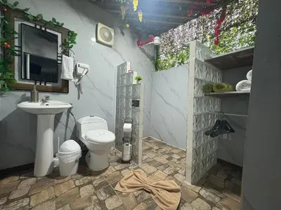 a small bathroom with a toilet and a sink at Apartamento doña Lety in Fortuna