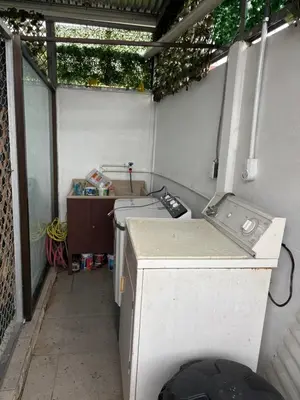 an outdoor kitchen with a washing machine in a trailer at Apartamento doña Lety in Fortuna