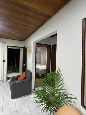 a living room with a couch and a bedroom at Downtown volcano House in Fortuna