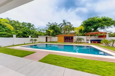 a swimming pool in the backyard of a house at Casa Corales Dreams 2 in Playa Flamingo