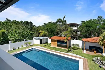 an aerial view of the backyard of a house with a swimming pool at Casa Corales Dreams 2 in Playa Flamingo