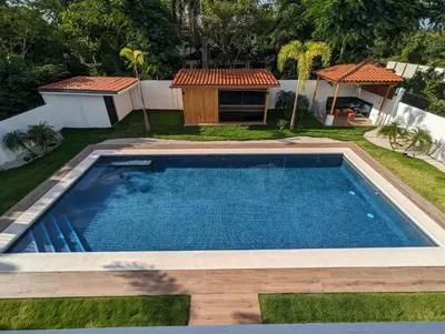 a swimming pool in a yard with a gazebo at Casa Corales Dreams 2 in Playa Flamingo