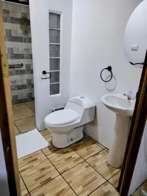 a bathroom with a toilet and a sink at Cabana Castaña in Marsella