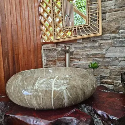 a large stone tub in a bathroom with a mirror at Love Glamping Dome in El Hogar