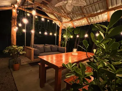a living room with a couch and a table at Casa Bonita - 5br With Pool Walk To Beach! in Nosara