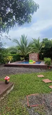 a garden with a playground in the middle of it at Villa Guayacanes Forest in Chachagua
