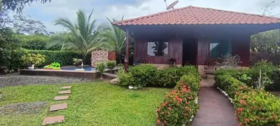 a small house with a garden in front of it at Villa Guayacanes Forest in Chachagua