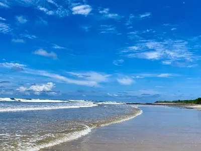 a beach with a blue sky and the ocean at Palmas Resort De Tamarindo Serenity Gem in Villarreal