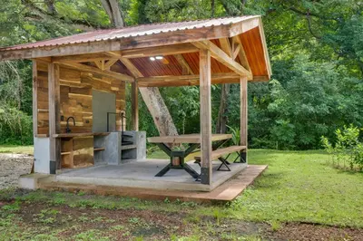 a wooden pavilion with a picnic table in a park at Monte Donato 18 - Apt 2 in Playa Avellana