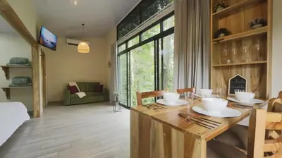 a dining room with a table with bowls and plates on it at Cabana Nicolia in San Francisco