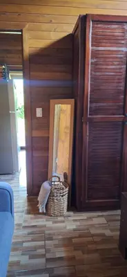 a room with a basket and a wooden wall at Casa Manglar in Coronado