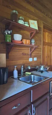 a kitchen with a sink and a counter top at Casa Manglar in Coronado