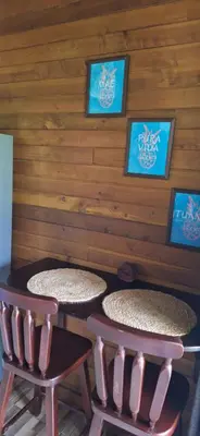 a room with two tables and two stools at Casa Manglar in Coronado