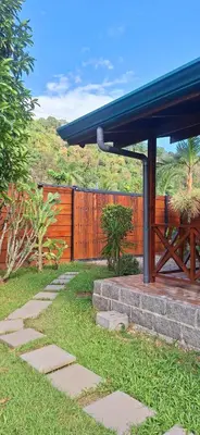 a house with a wooden fence and a stone pathway at Casa Manglar in Coronado
