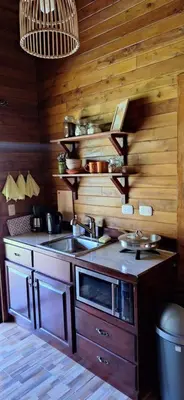 a kitchen with a sink and a counter top at Casa Manglar in Coronado