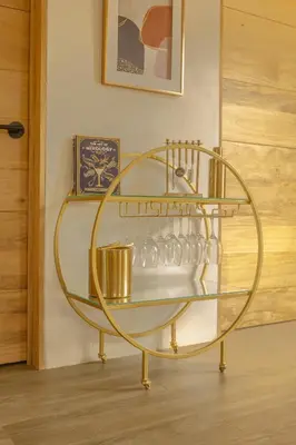 a round glass shelf with glasses on it at Casa Tres Luces - Samara Home in Nicoya