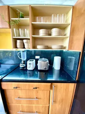 a kitchen with a counter top with appliances on it at villa country club cariari in Ciudad Cariari