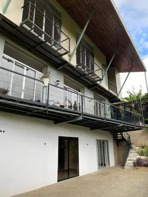 an apartment building with balconies and a patio at villa country club cariari in Ciudad Cariari