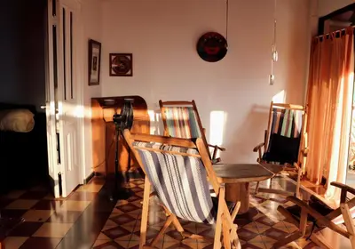 a room with two chairs and a table and a camera at Terraza Suite Frente al Mar in Puntarenas