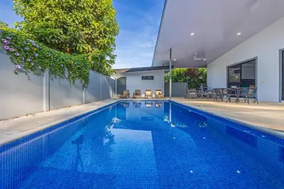 a swimming pool in the backyard of a house at CASA SERENITY , brand new house, walk 2 beach, private pool, wifi, PURA VIDA!!!! in Uvita