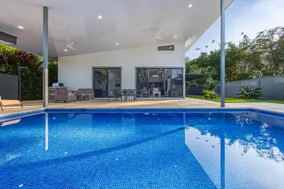 a swimming pool in the backyard of a house at CASA SERENITY , brand new house, walk 2 beach, private pool, wifi, PURA VIDA!!!! in Uvita