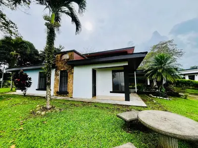 a house with a bench in front of it at House view of the sunrise, 4 rooms in San Gerardo