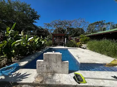 a swimming pool in the middle of a yard at 16 minutes from Tamarindo in Portegolpe