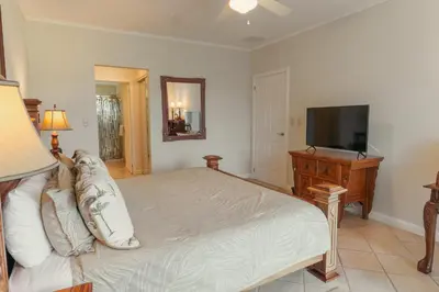 a bedroom with a bed and a flat screen tv at CR Luxury Del Mar 2Q 3 Bdrm in La Mona